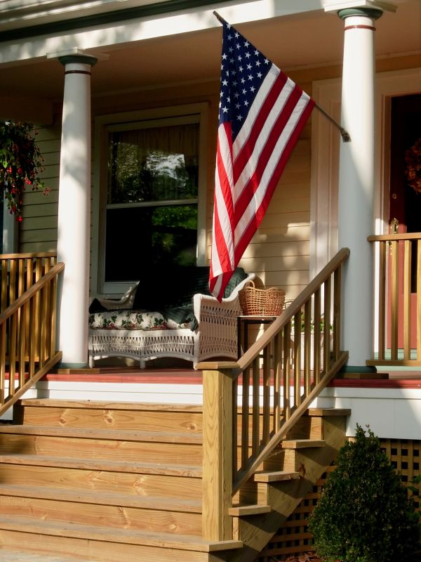 How A Freestanding Porch Installation Enhances Backyard Functionality